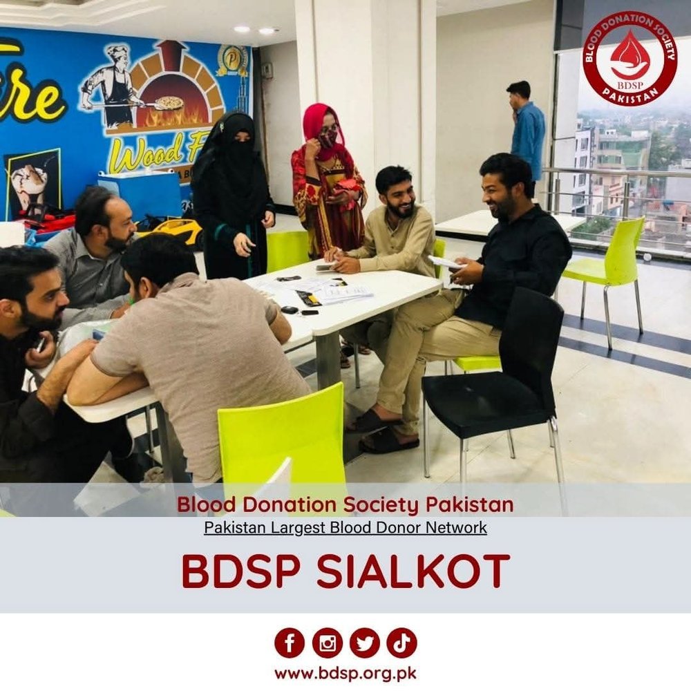 Volunteers at the donor registration desk in Sialkot